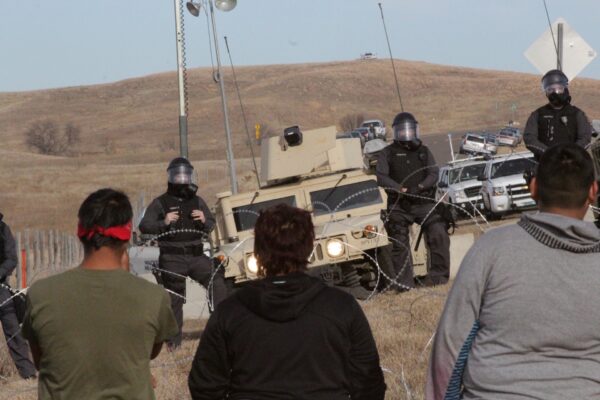 Image of Police and Water Protectors at Standing Rock