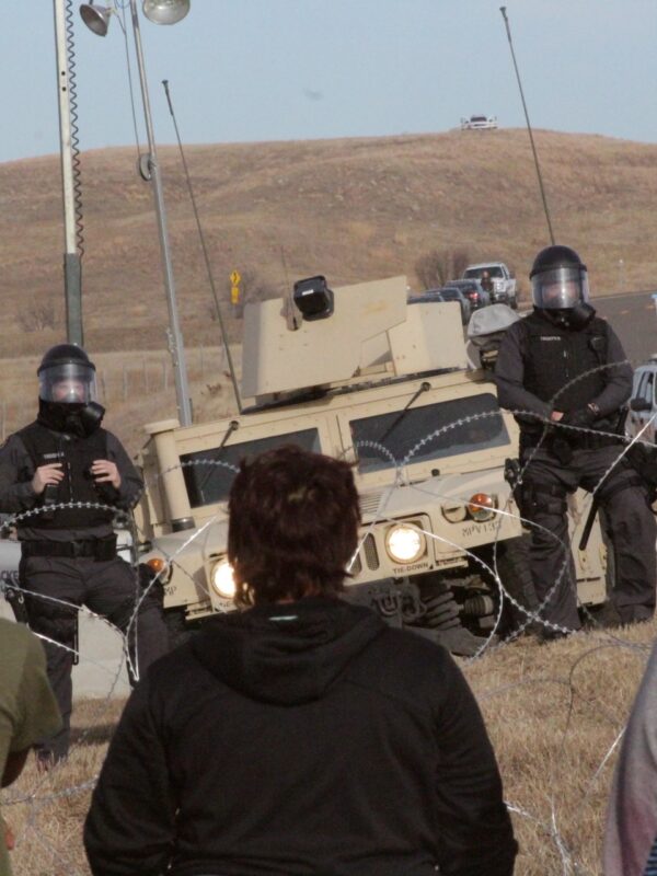 Image of Police and Water Protectors at Standing Rock