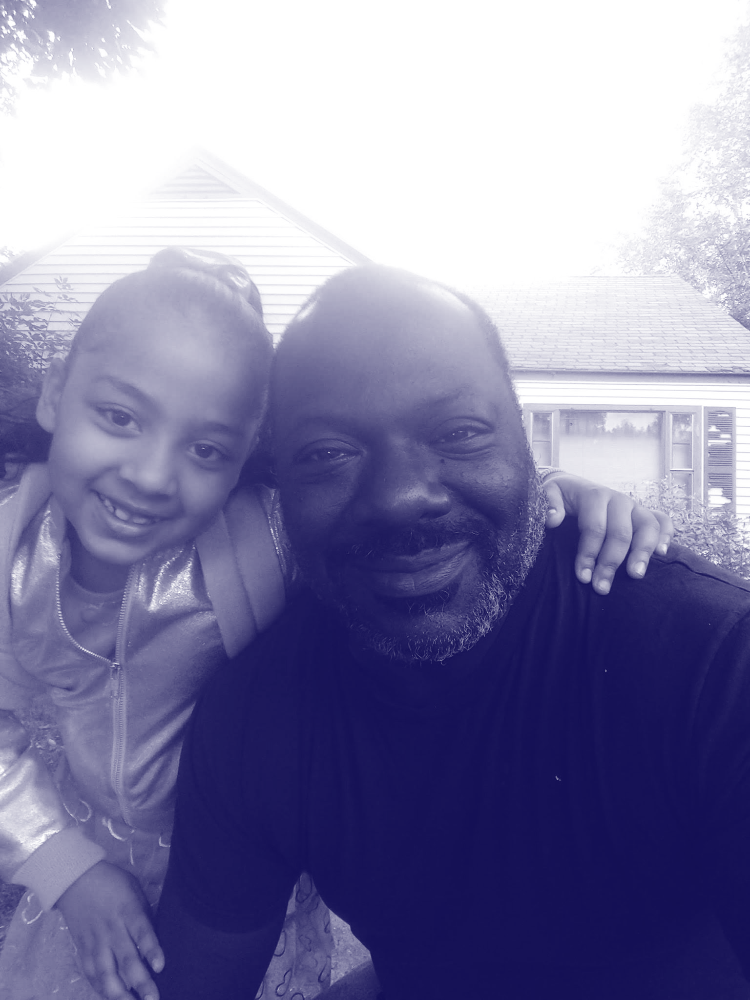 Photograph of Andre with child