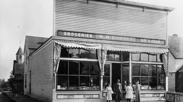 W.R. Dorsey Groceries-Hay-Grain 900 8th Avenue in Helena [Walter Dorsey with his 2 daughters in doorway] Photograph by Edward Reinig ca. 1899-1929 MHS Photo Archives, PAc 74-104.266 GP