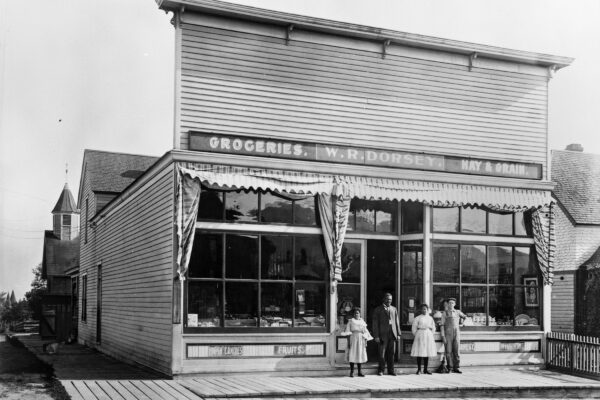 W.R. Dorsey Groceries-Hay-Grain 900 8th Avenue in Helena [Walter Dorsey with his 2 daughters in doorway] Photograph by Edward Reinig ca. 1899-1929 MHS Photo Archives, PAc 74-104.266 GP
