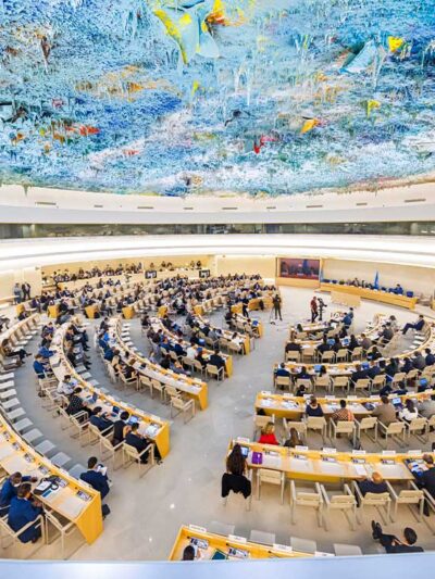 Delegates, arrayed in an expanding circle of desks, attend the 50th session of the Human Rights Council, at the European headquarters of the United Nations in Geneva, Switzerland.