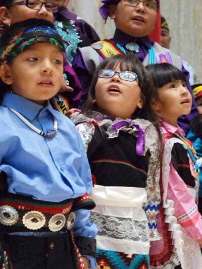 Children from the Zuni Pueblo lead the U.S. pledge of allegiance in the Zuni language in the New Mexico state Capitol in Santa Fe, N.M.