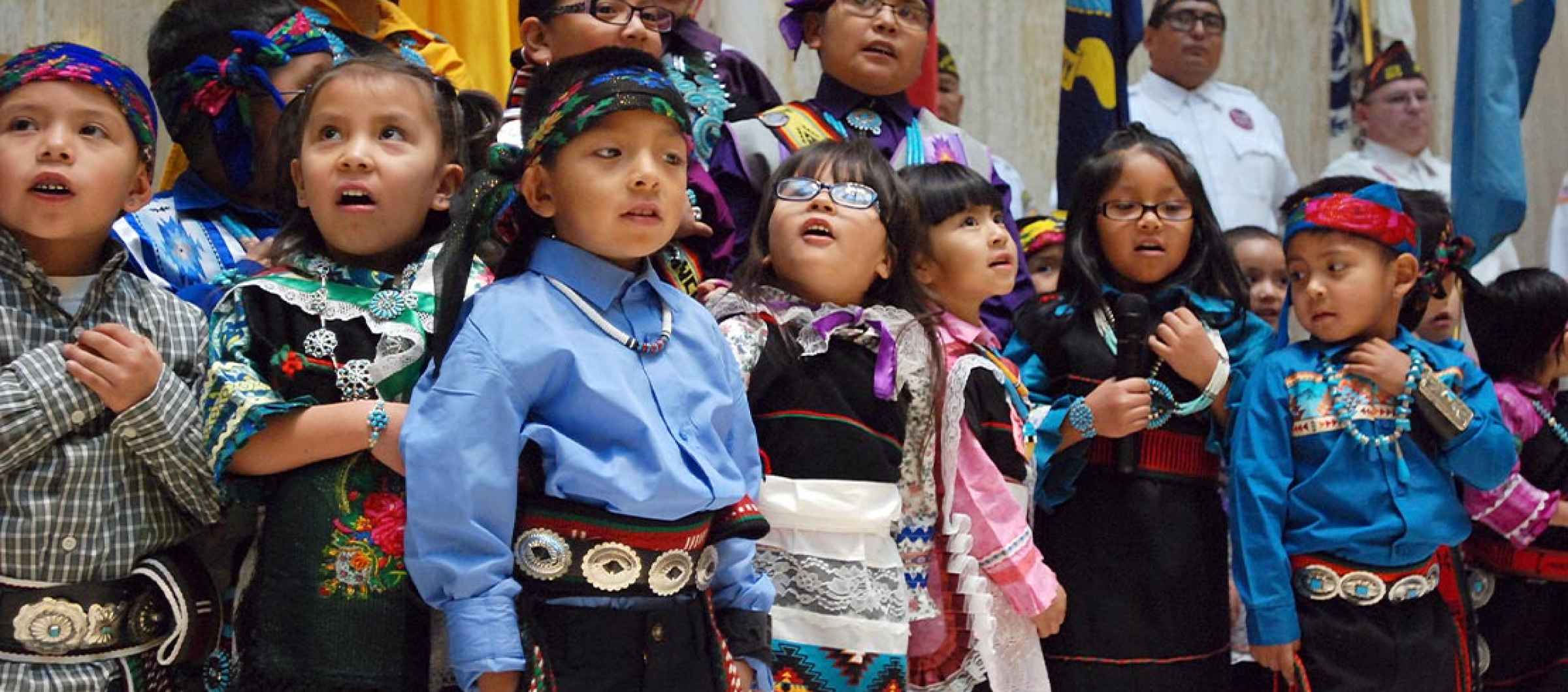 Children from the Zuni Pueblo lead the U.S. pledge of allegiance in the Zuni language in the New Mexico state Capitol in Santa Fe, N.M.