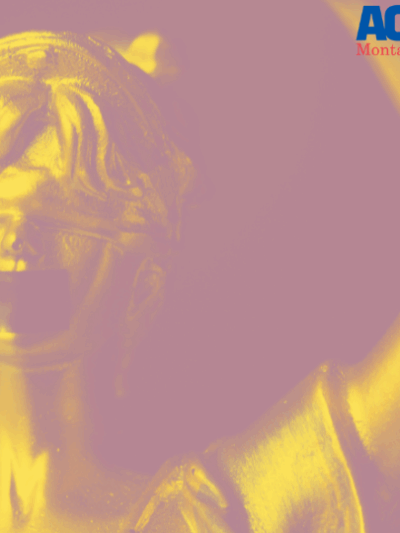 A graphic of a statue with black tape over its liips