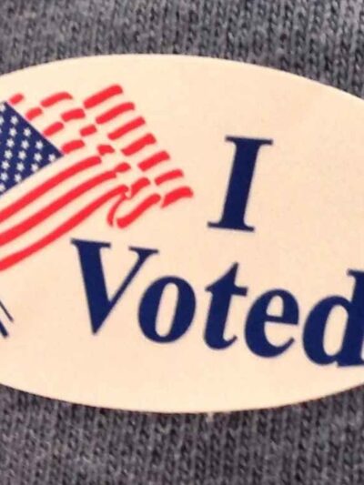 An "I voted" sticker with an American flag