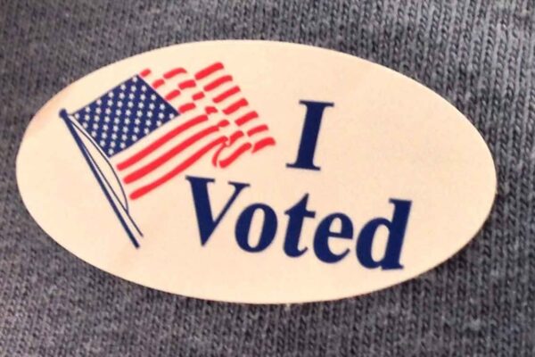 An "I voted" sticker with an American flag