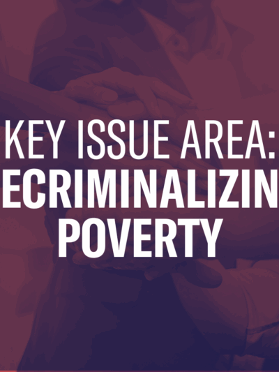 The text "Key Issue Area: Decriminalizing Poverty" over a photo of people holding hands