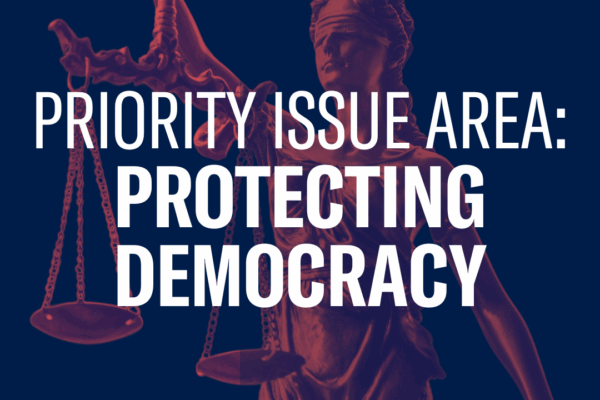 Text reading "Priority Issue Area: Protecting Democracy" over a photo of a statue of justice