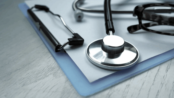 stethoscope lying on a clipboard