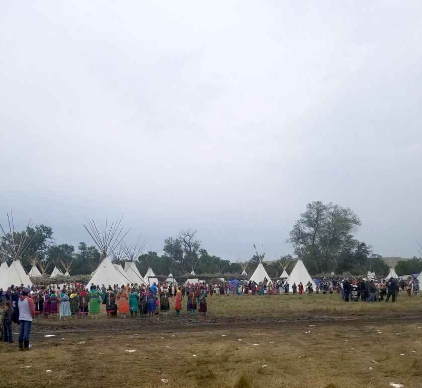 Image of people around a Crow Fair Camp