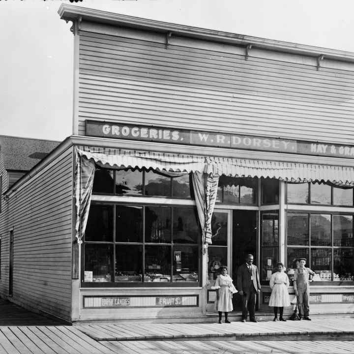 W.R. Dorsey Groceries-Hay-Grain 900 8th Avenue in Helena [Walter Dorsey with his 2 daughters in doorway] Photograph by Edward Reinig ca. 1899-1929 MHS Photo Archives, PAc 74-104.266 GP